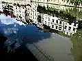 Reflection of houses at the Cankar Embankment