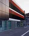 Artinstallation at the outside facade of the headquarter of the Sparkasse Gütersloh–Rietberg, Gütersloh, Fluorescent acrylic glass, 2010, 86 Elements each 120 × 5 × 50 cm, side view