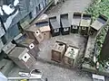 Repaired nestboxes for blue and great tits, unrepaired box at centre