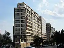 A wedge-shaped, blocky modern building with large windows