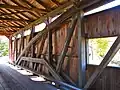 Interior, showing the rare combination of queen post and Burr arch trusses