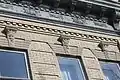 Architectural detail on one of the buildings.  Note carved faces over windows.