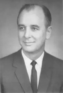 Black and white portrait of a man wearing a suit