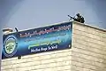 An RISF policeman providing security atop the Raqqa Civil Council building, 18 August 2018