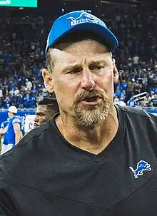 Dan Campbell head shot in a Detroit Lions hat