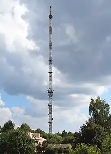 Colour photo of Rivne TV Tower surrounded by trees