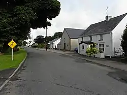 Road through Drum. The building with the gable towards the road is the Protestant Hall.