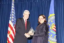 Aftab accepting an award from FBI Director Robert Mueller in 2010