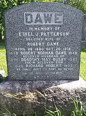 Grey granite stone inscribed with family's names and dates