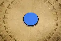 Close interior photo of the Pantheon's circular oculus opening at the center of the domed ceiling