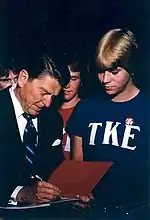 Frater Ronald Reagan is signing autographs for his fellow Tekes