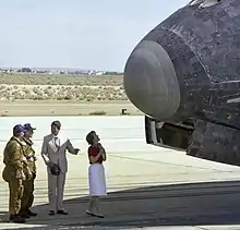 President Reagan and his wife Nancy observe the shuttle's forward tiles and nosecone.