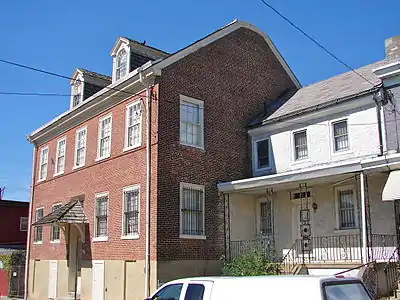 The small gray house at 4282 Griscom is not part of the National Register of Historic Places site