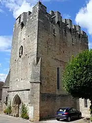 Bretèches protecting the door and windows of the fortified church at Rudelle, France