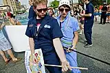 Shmaltz Brewing Company employees break into an impromptu air guitar solo on the Mermaid Parade route.