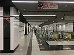 Flags and emblems of Malaysian states on the pillars at the Lower Concourse Level of the station.