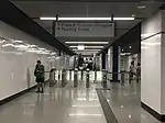 Fare gates leading out to Entrance A of the MRT station.