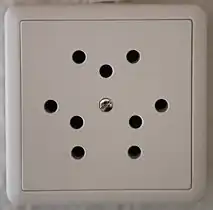 Type 12 triple socket (10 A), now obsolete and no longer sold or installed