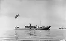 Antenna raising in 1915. The kite balloon ship HMS CANNING anchored off Salonika with kite balloon aloft, November 1915.