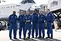 Commander Charles Hobaugh speaks on the tarmac