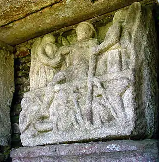 The resurrection. Jesus emerges from his tomb assisted by two angels.