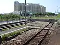 A view of the end of the tracks, with the level crossing.