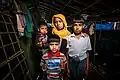 A Rohingya mother with her three children mourning for her elder son.