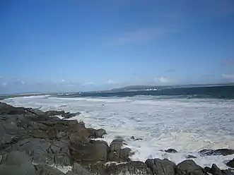 Outer bay with surf pounding the shore