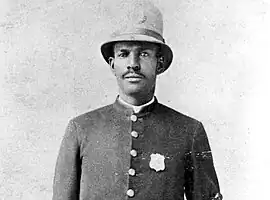 A Salt Lake City, Utah police officer wearing custodian helmet in 1874