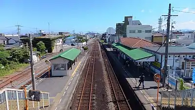 A view of the station platforms and tracks, looking in the direction of Tokushima.