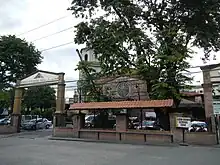 The view of the church façade behind the trees