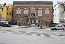 Exterior of the Chinatown Branch Library, showing the dual staircase entrance