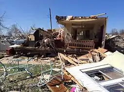 An image depicting the remains of a destroyed double-wide mobile home in Sand Springs, Oklahoma.