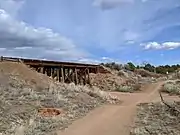 One of many trestle bridges along the trail. Here the trail has improved natural surface