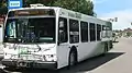 A New Flyer D40LFR, painted in Saskatoon Transit's DART paint scheme, with bike carrier, received in 2006.