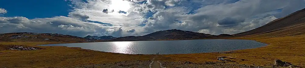 Lake with low mountains in the background