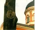 Carving in a tree on the territory of the monastery