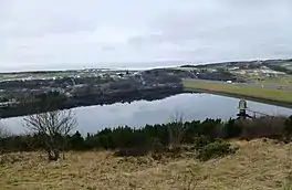 Image of a lake in wintertime with a motorway across the dam head