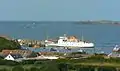 Scillonian III at the pier at St Mary's as seen from a distance