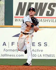 A baseball player in white