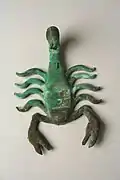 Moche scorpion ornament in gilded copper, Peru, 6th to 7th century AD