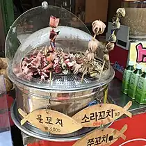 Seafood skewers sold in South Korea, including jju-kkochi (webfoot octopus skewers)