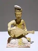 One of a group of seated female musicians