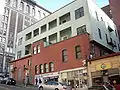 The upper portion of the Drexel Hotel Building is a wood-framed structure that predates the great fire, but it was re-clad with new materials after 1945