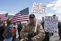 Man carrying placard