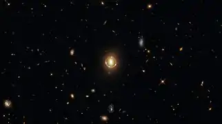 "Seeing Quintuple" a phenomenon known as gravitational lensing.