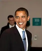 On the left: an image of Barack Obama in a black suit.