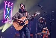 Performing with The Avett Brothers in November 2017