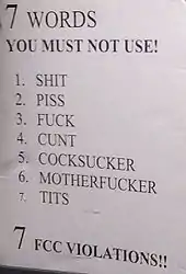 Sign displaying seven words that should not be used on the radio