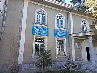 Reference books in Uzbek and Russian languages hung on the church wall